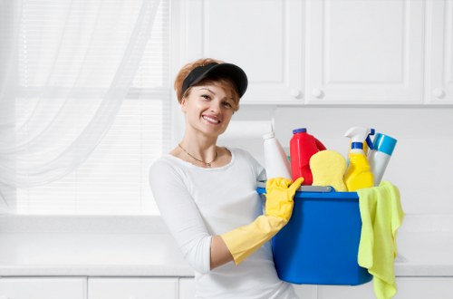 Detail-focused professional cleaners restoring cleanliness in a room