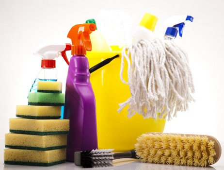 Professional cleaner in Balham maintaining an office workspace